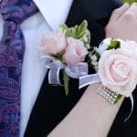 Hands of date Prom night flowers corsage formal wear