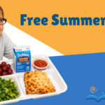 Girl sitting and eating off of a lunch tray